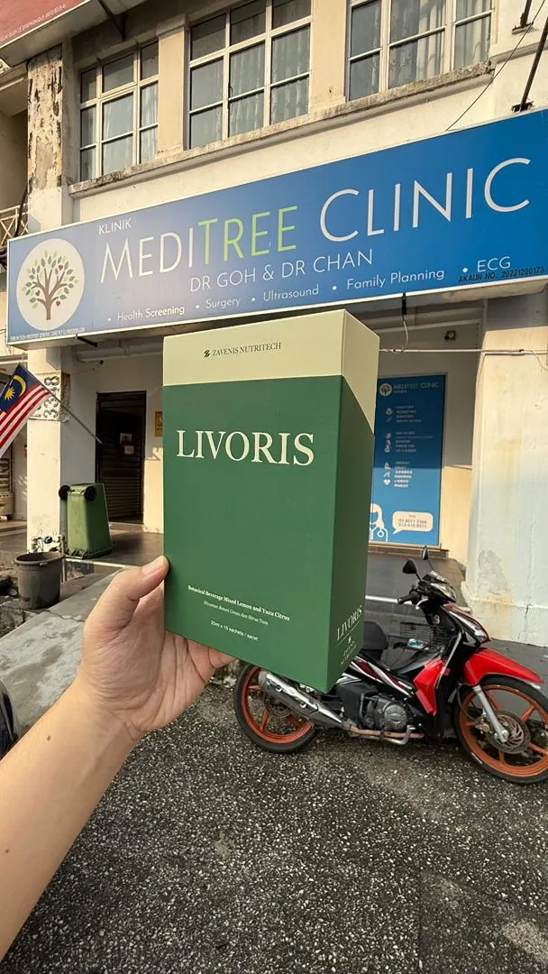 Livoris box held in front of MEDITREE CLINIC storefront